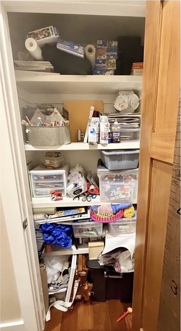 Craft closet with scattered supplies before organizing